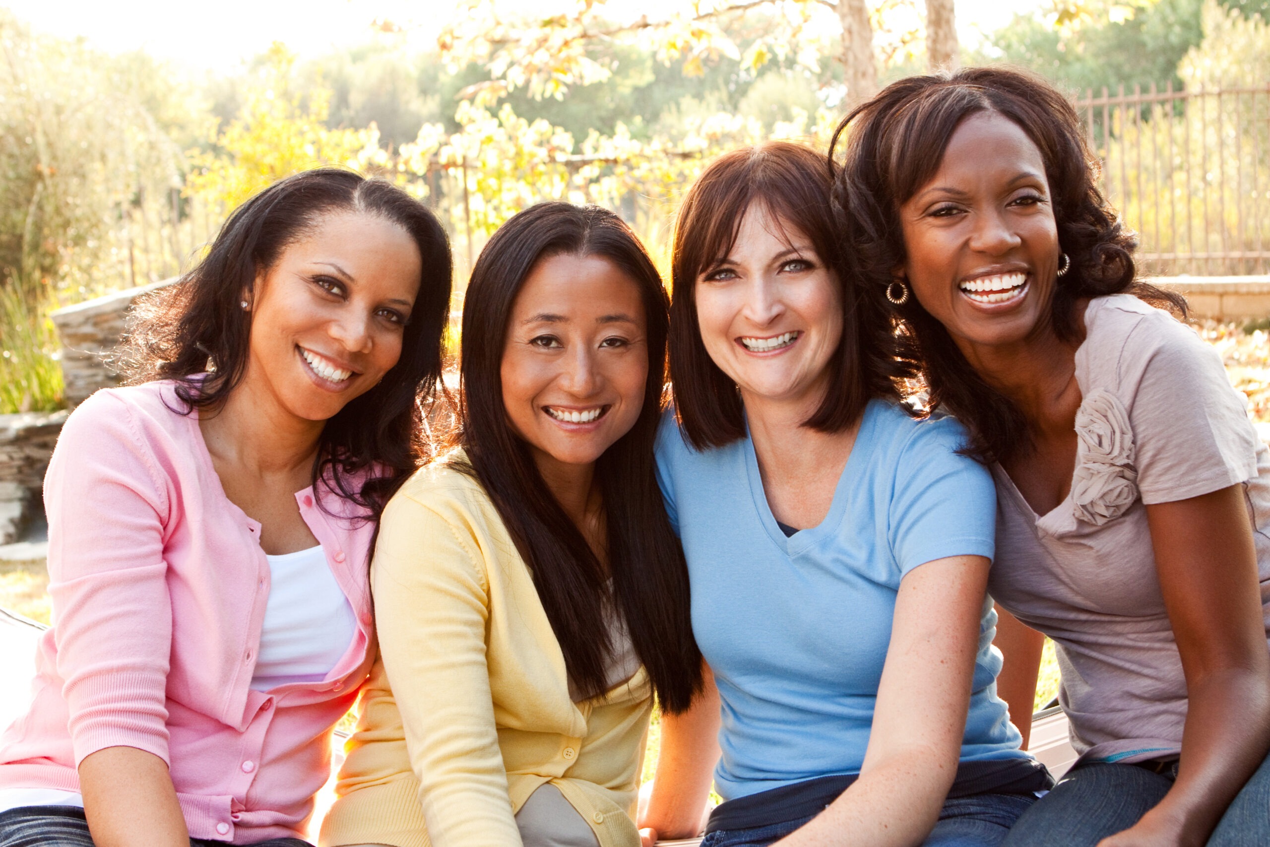 Diverse group of women talking and laughing.